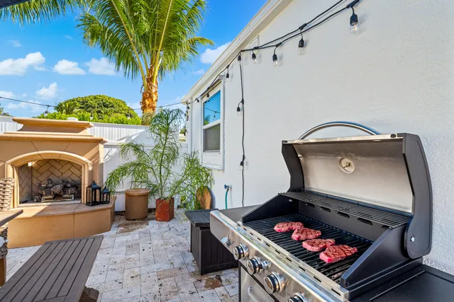 a view of a white house with a yard