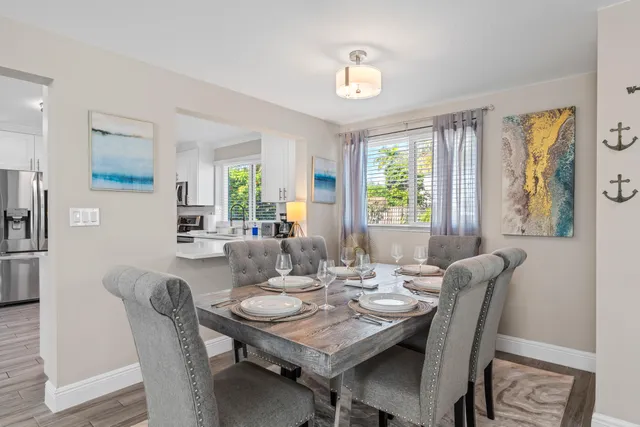 a view of a dining room with furniture and window