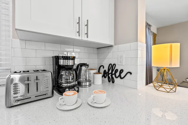 a kitchen with a stove and a microwave