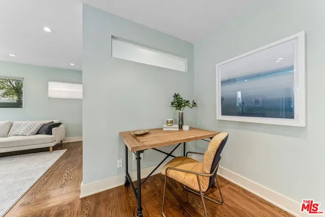 a view of hallway with wooden floor