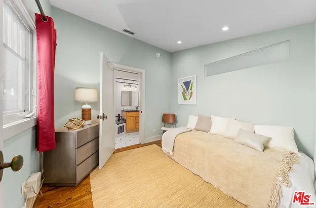 a spacious bathroom with a sink a toilet and shower