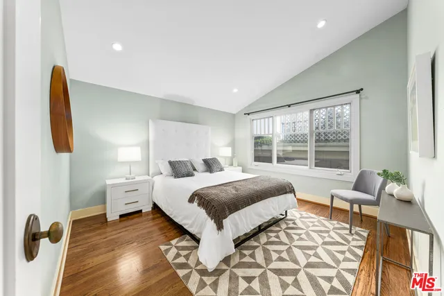 a view of a house with backyard sitting area and tub