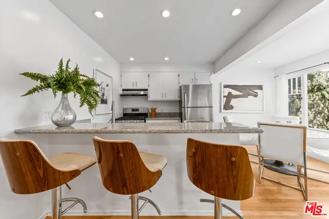 a kitchen with refrigerator and countertop