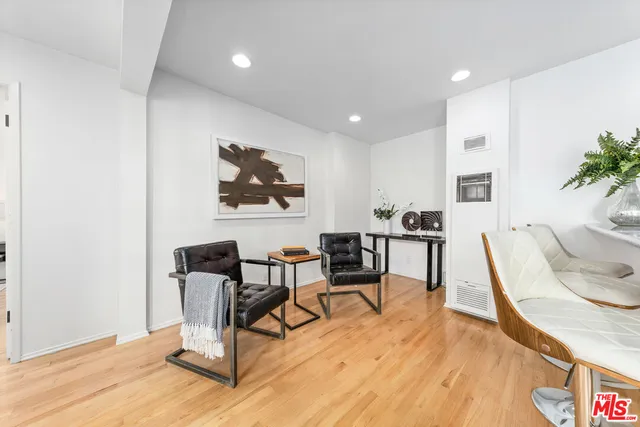 a bed room with a bed and a chair