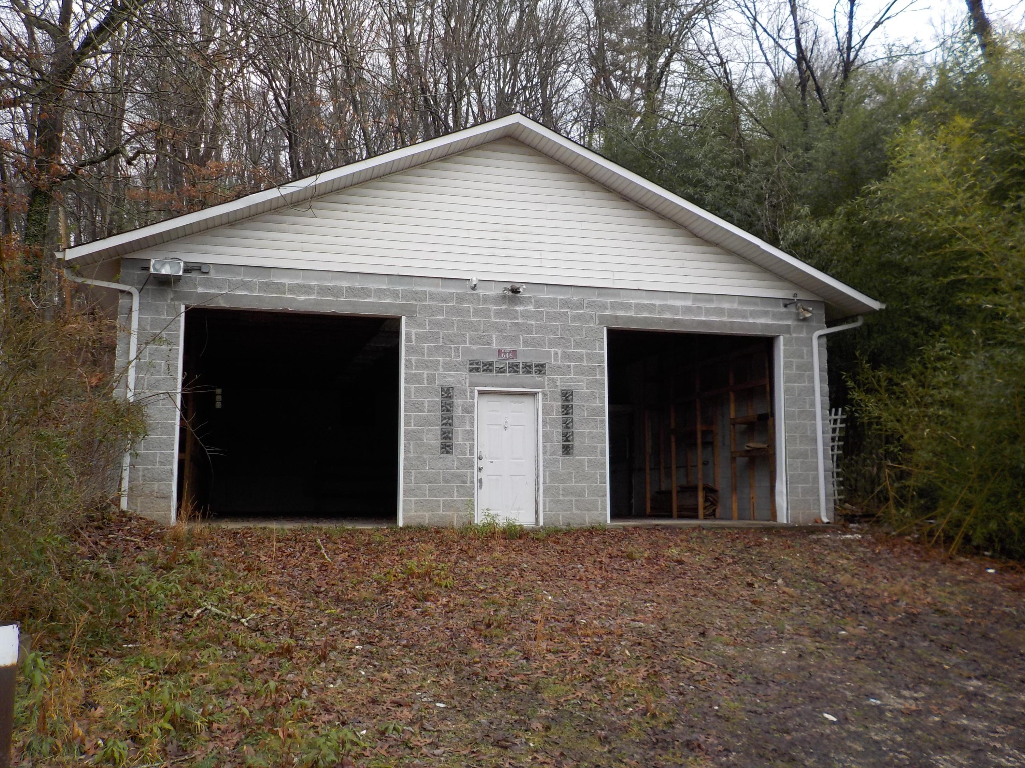 646 Edgemoor Road Powell, TN 37849 - Photo 20 of 22 a view of a house with a yard and garage