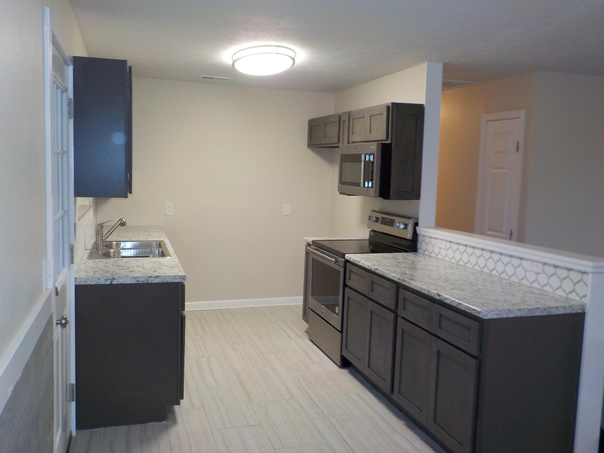 646 Edgemoor Road Powell, TN 37849 - Photo 3 of 22 a kitchen with a sink and cabinets