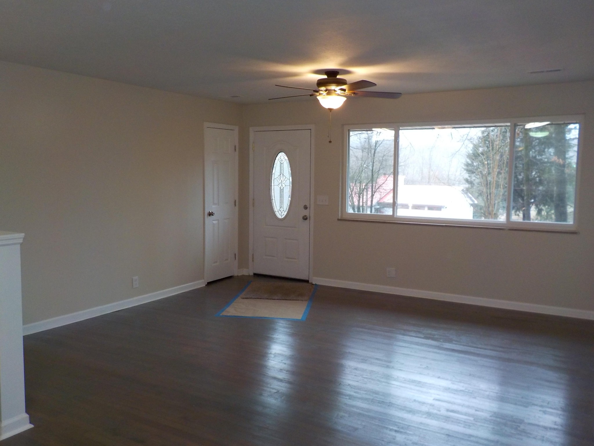 646 Edgemoor Road Powell, TN 37849 - Photo 5 of 22 an empty room with wooden floor and windows