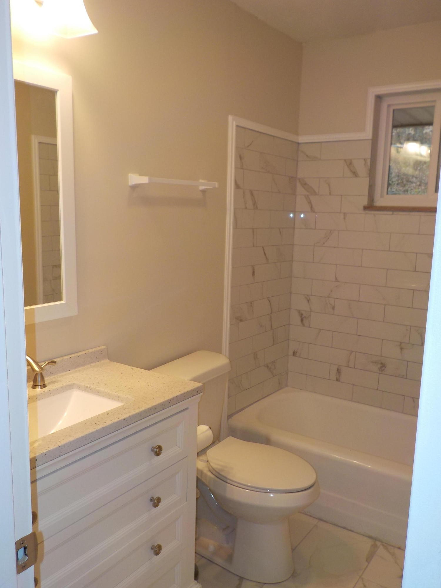646 Edgemoor Road Powell, TN 37849 - Photo 7 of 22 a bathroom with a sink a toilet and shower