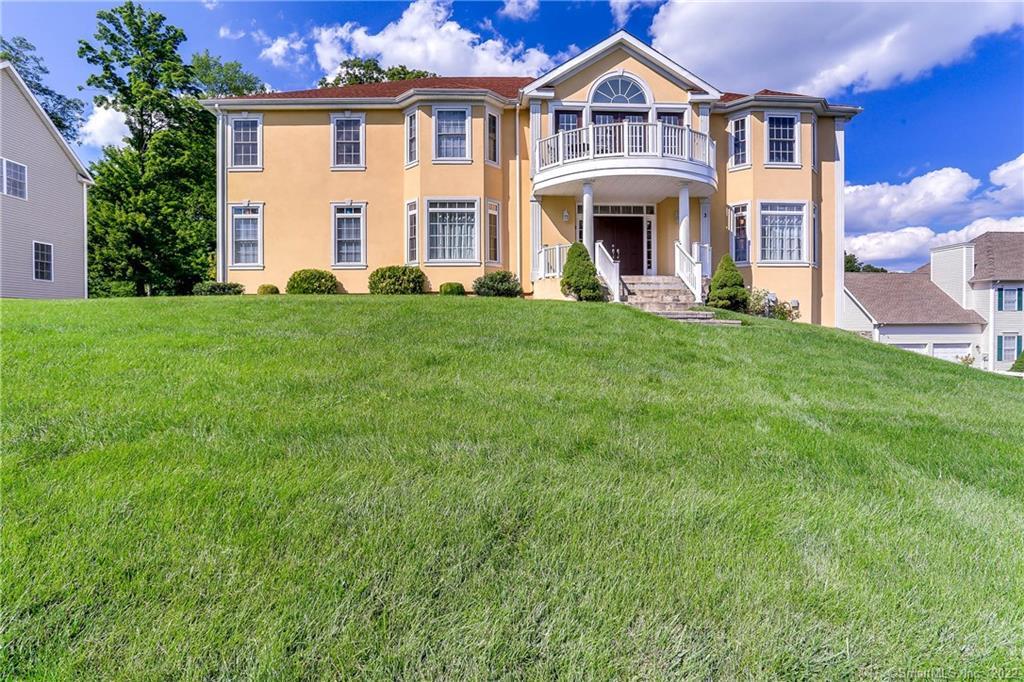 a front view of a house with a yard
