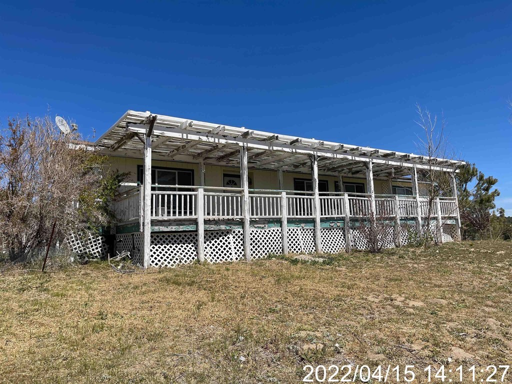 61650 Tamatea Road Anza, CA 92539 - Photo 1 of 1 a front view of a house with a yard