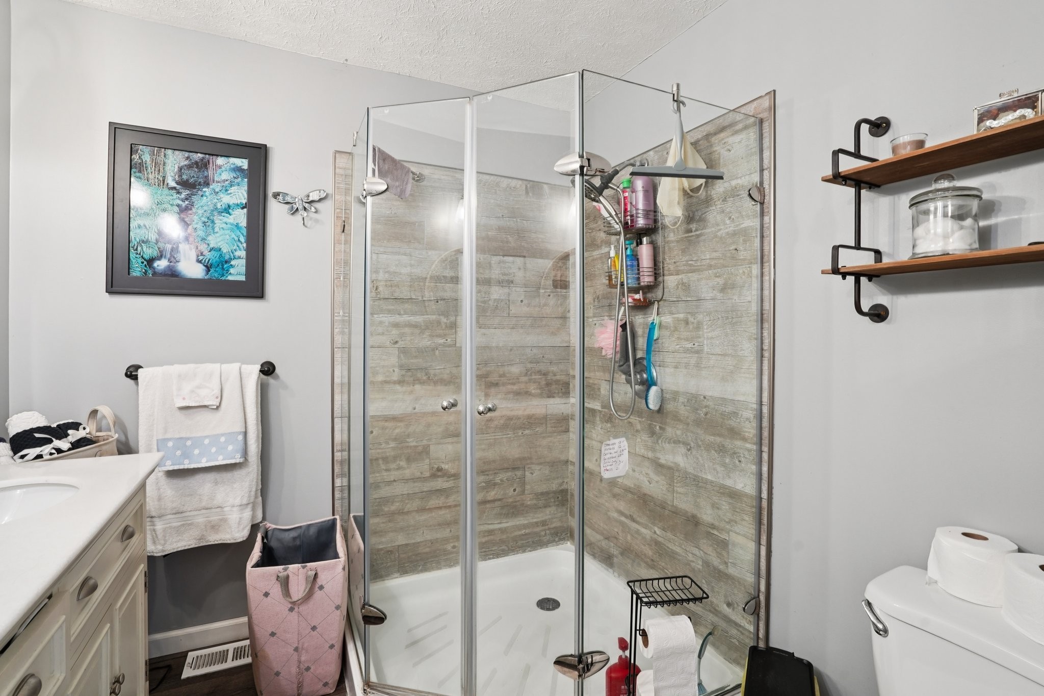 7559 Scottsville Road Lafayette, TN 37083 - Photo 17 of 42 a bathroom with a shower toilet and sink