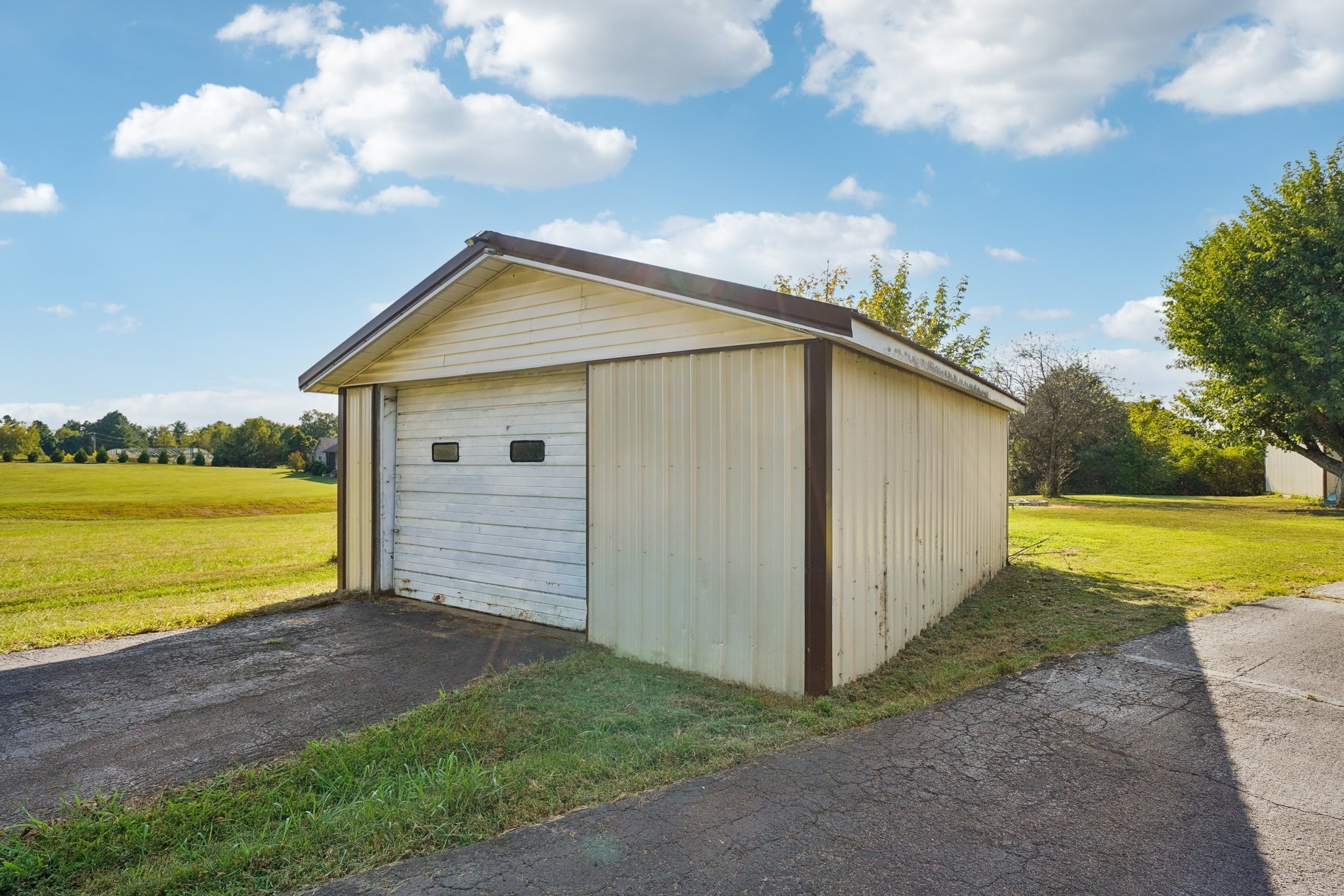 7559 Scottsville Road Lafayette, TN 37083 - Photo 30 of 42 a view of a house with a backyard