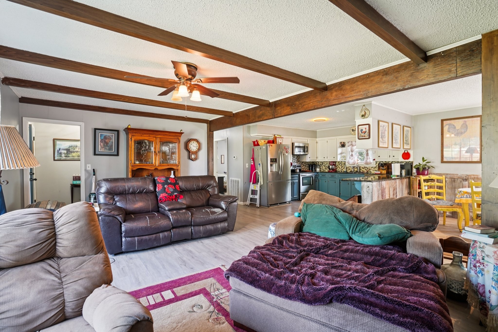 7559 Scottsville Road Lafayette, TN 37083 - Photo 8 of 42 a living room with furniture and a chandelier