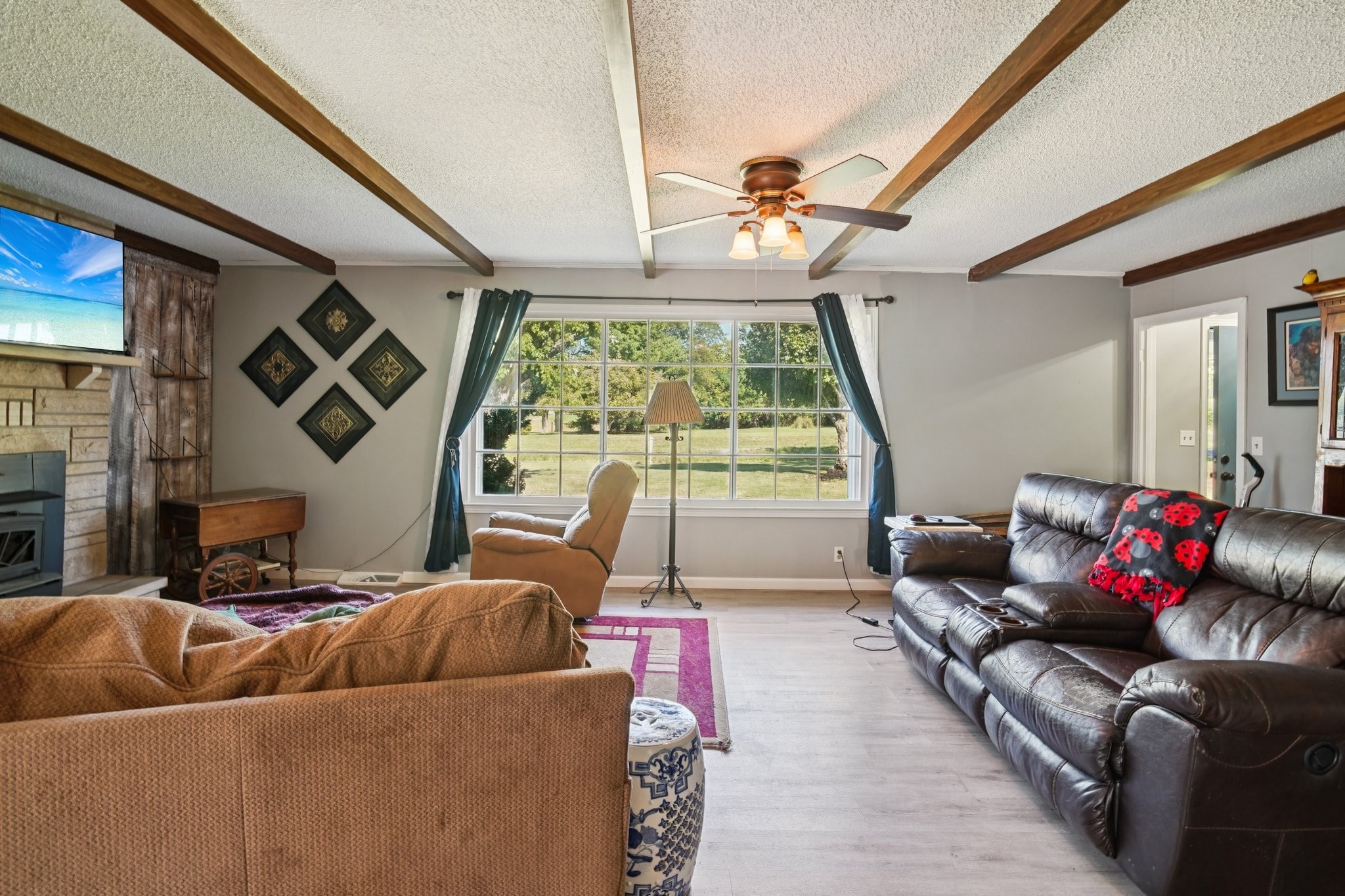 7559 Scottsville Road Lafayette, TN 37083 - Photo 9 of 42 a living room with furniture and a large window