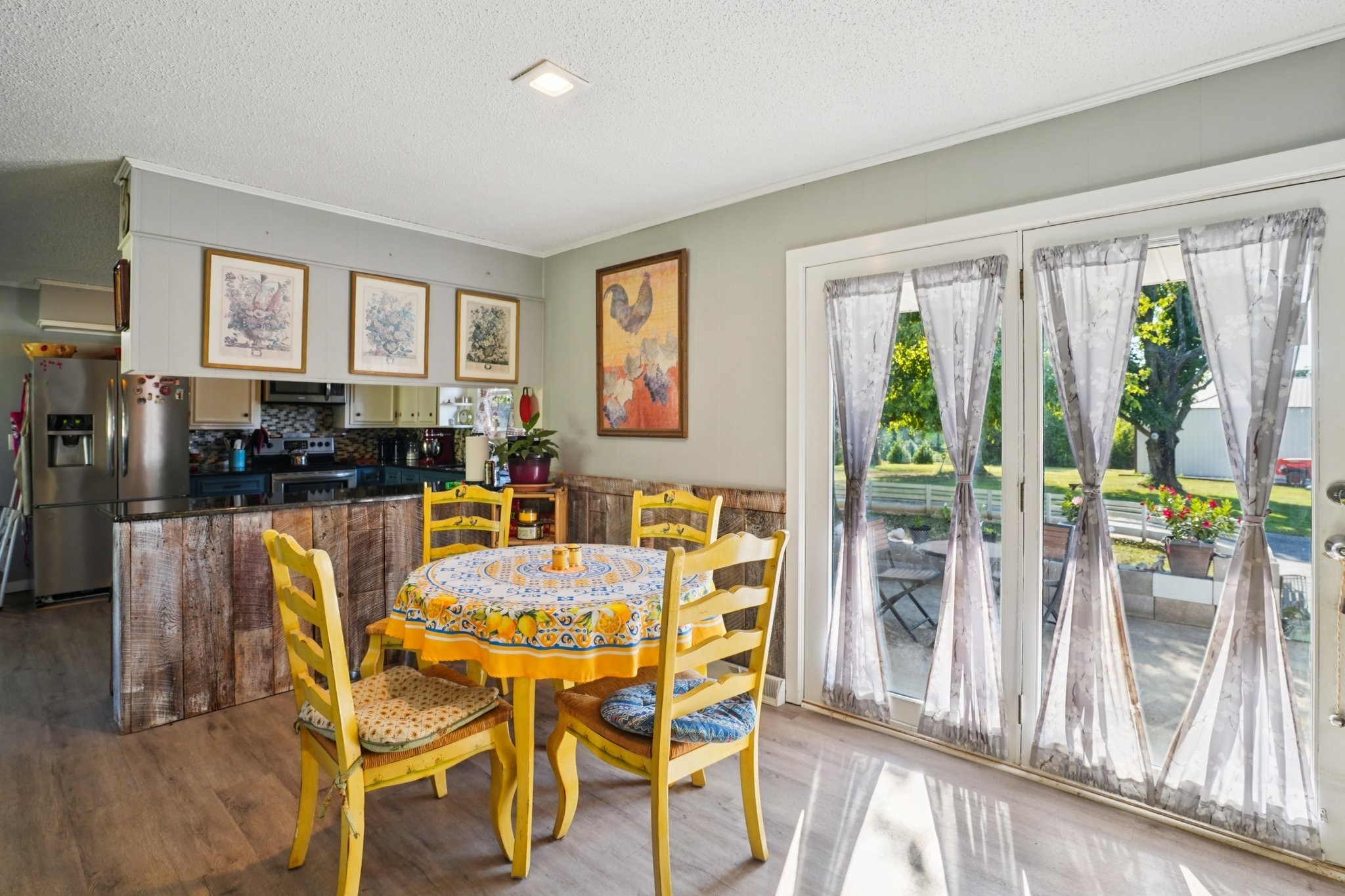 7559 Scottsville Road Lafayette, TN 37083 - Photo 10 of 42 a dining room with furniture and large windows