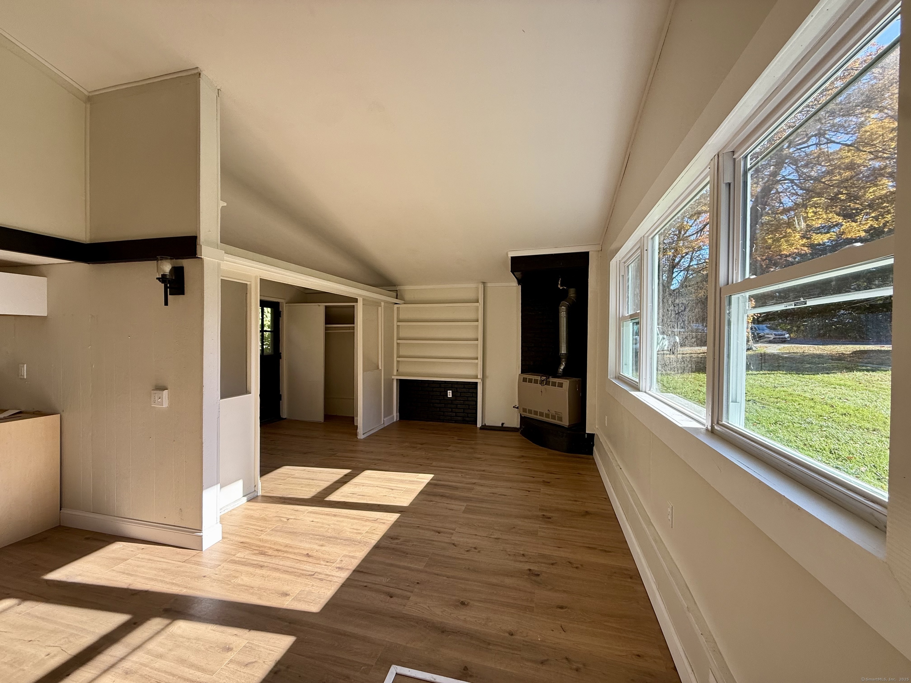 41 Waterbury Road, Unit B1 Prospect, CT 06712 - Photo 2 of 10 a view of a balcony with wooden floor and a large window