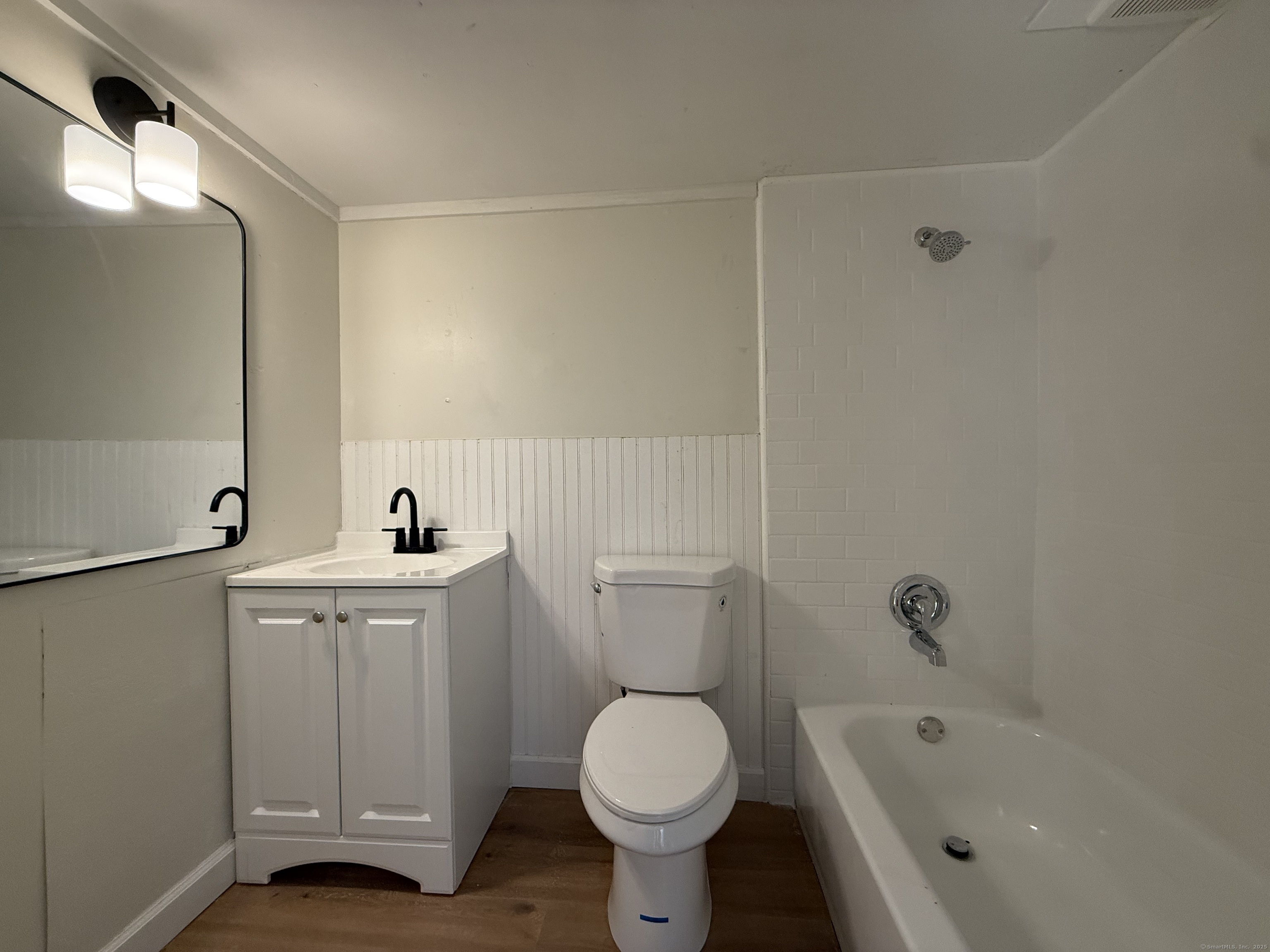 41 Waterbury Road, Unit B1 Prospect, CT 06712 - Photo 8 of 10 a bathroom with a toilet sink and mirror