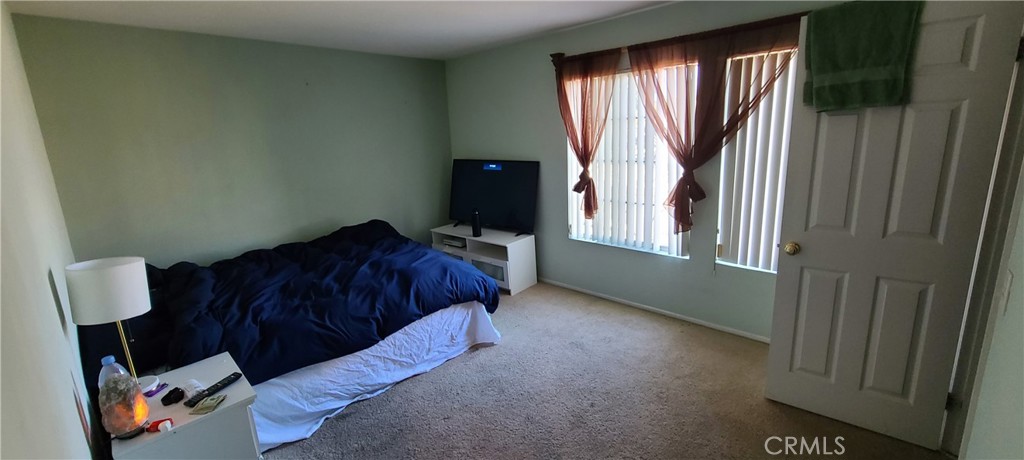 2563 Gilbert Avenue Corona, CA 92881 - Photo 11 of 21 a living room with furniture and a window