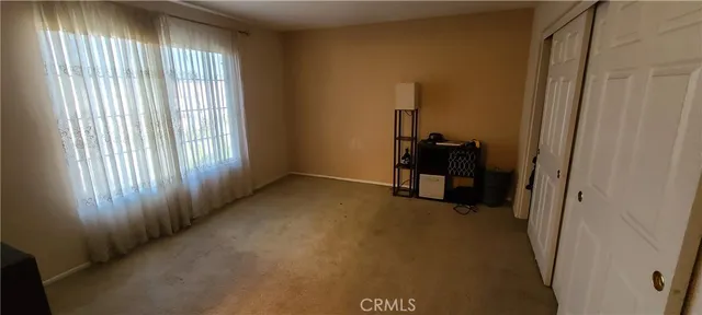 a view of a room that has a window