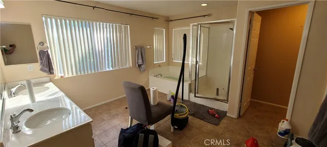 a view of a bathroom with a tub and sink
