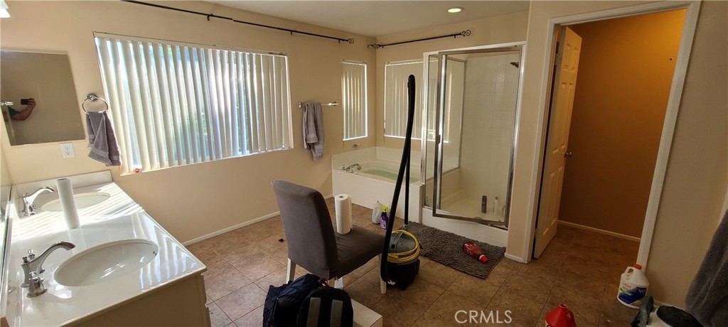 2563 Gilbert Avenue Corona, CA 92881 - Photo 18 of 21 a view of a bathroom with a tub and sink