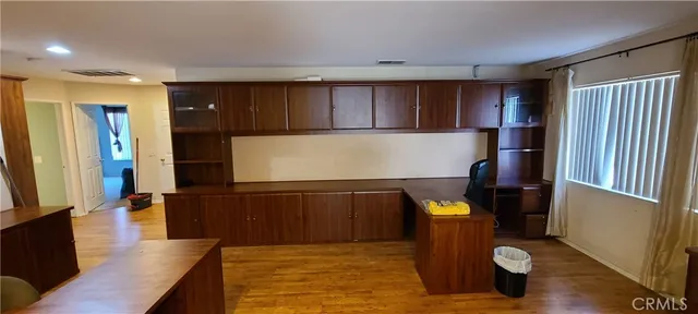 a kitchen with refrigerator and window