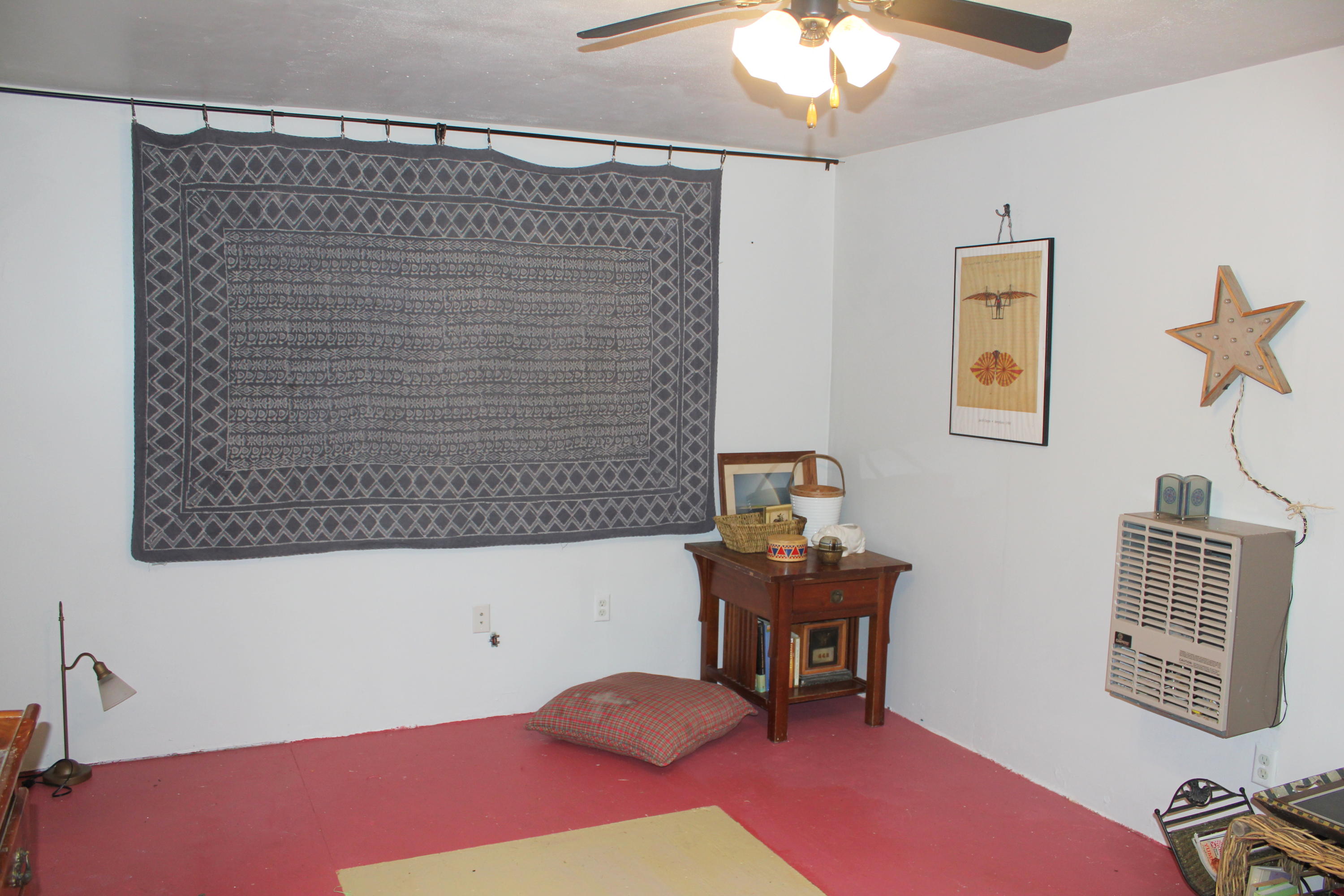 128 Turtleback Road Marstons Mills, MA 02648 - Photo 15 of 20 a bedroom with a bed and a chandelier