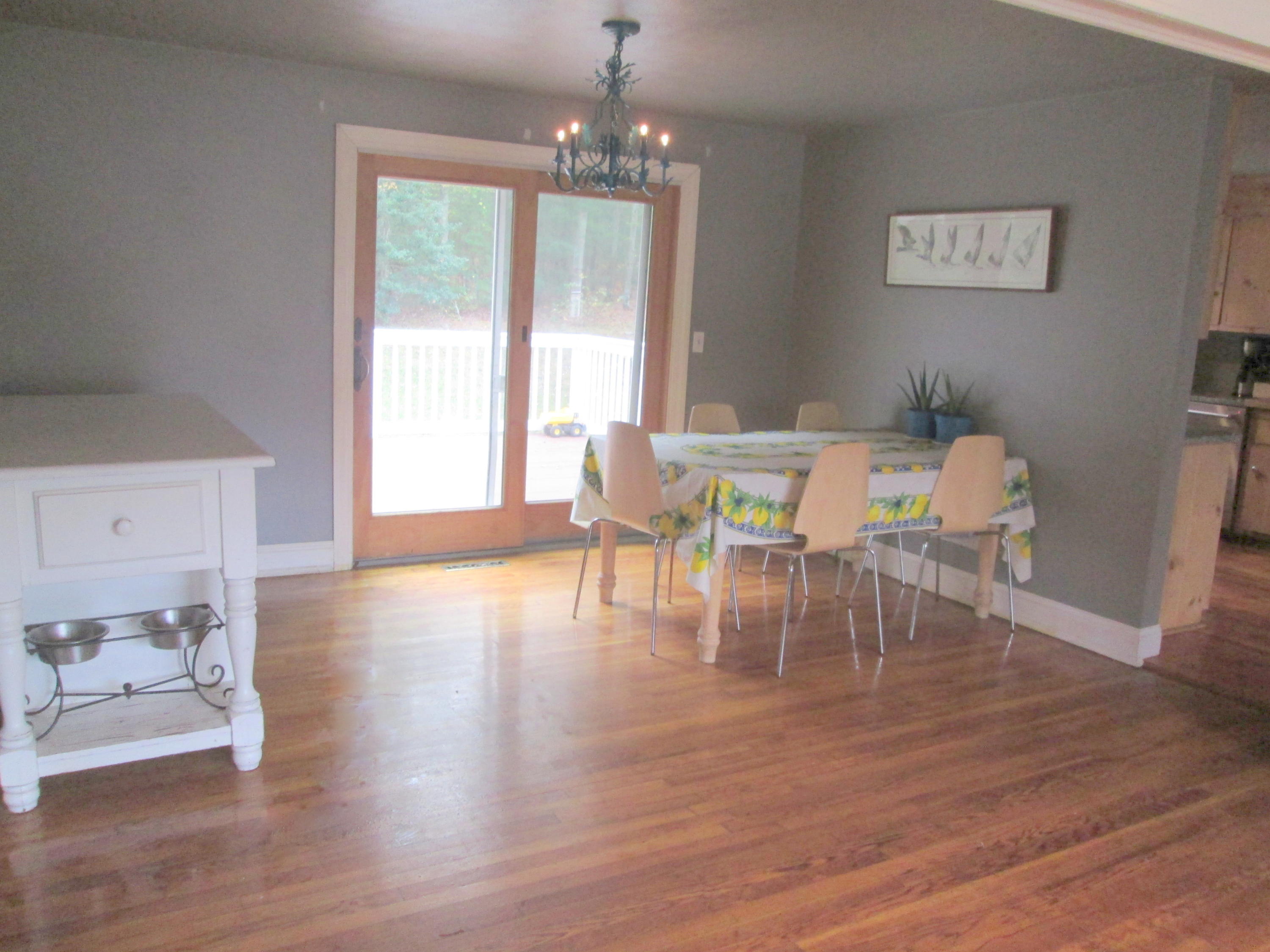 128 Turtleback Road Marstons Mills, MA 02648 - Photo 4 of 20 a view of a dining room with furniture window and wooden floor