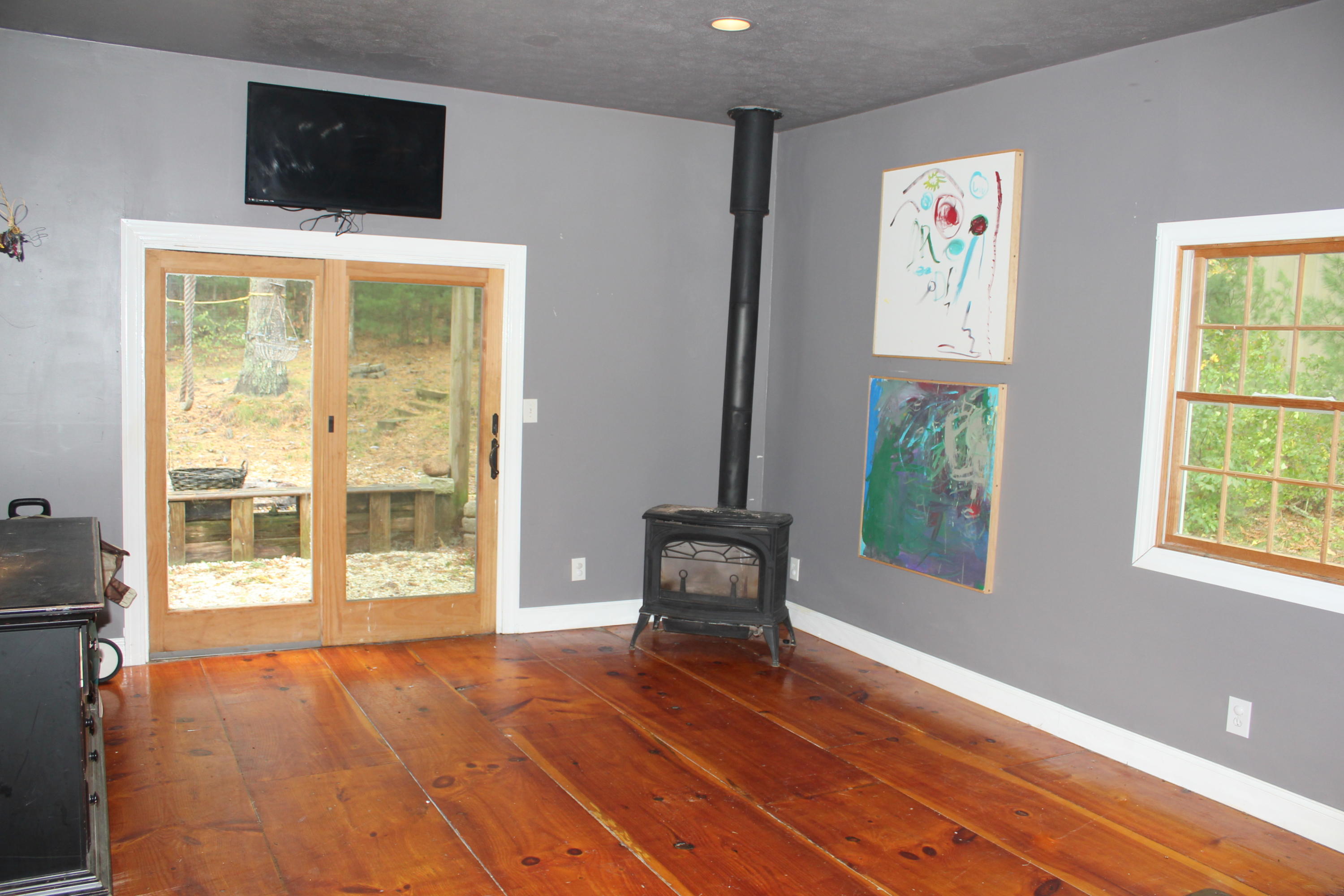 128 Turtleback Road Marstons Mills, MA 02648 - Photo 9 of 20 a living room with furniture and a flat screen tv