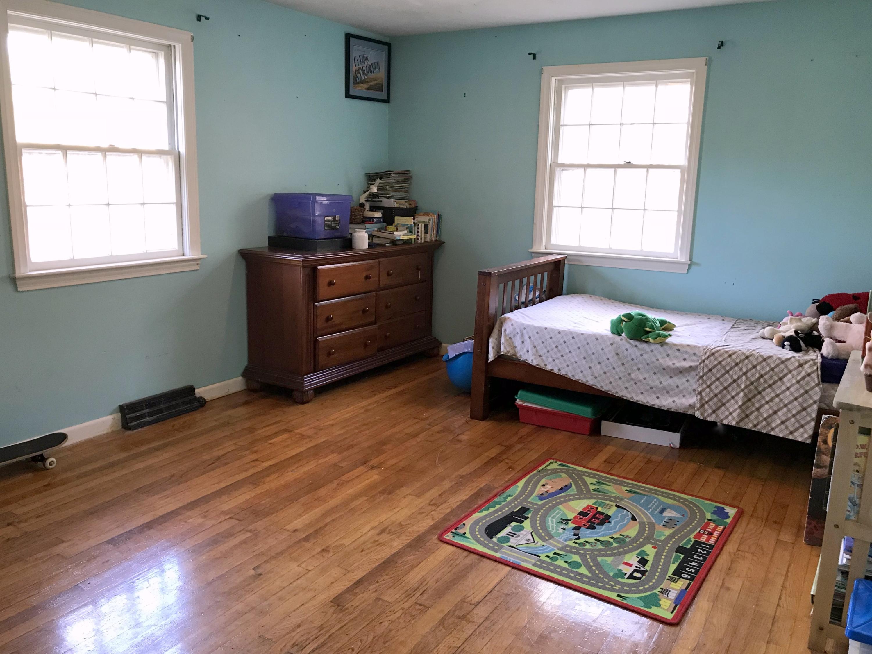 128 Turtleback Road Marstons Mills, MA 02648 - Photo 10 of 20 a bedroom with a bed window and wooden floor
