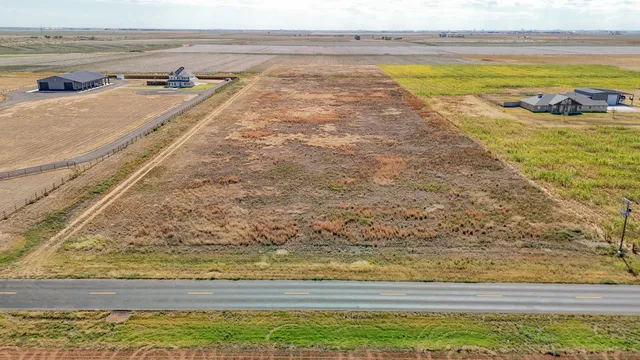 a view of a swimming pool and an outdoor space