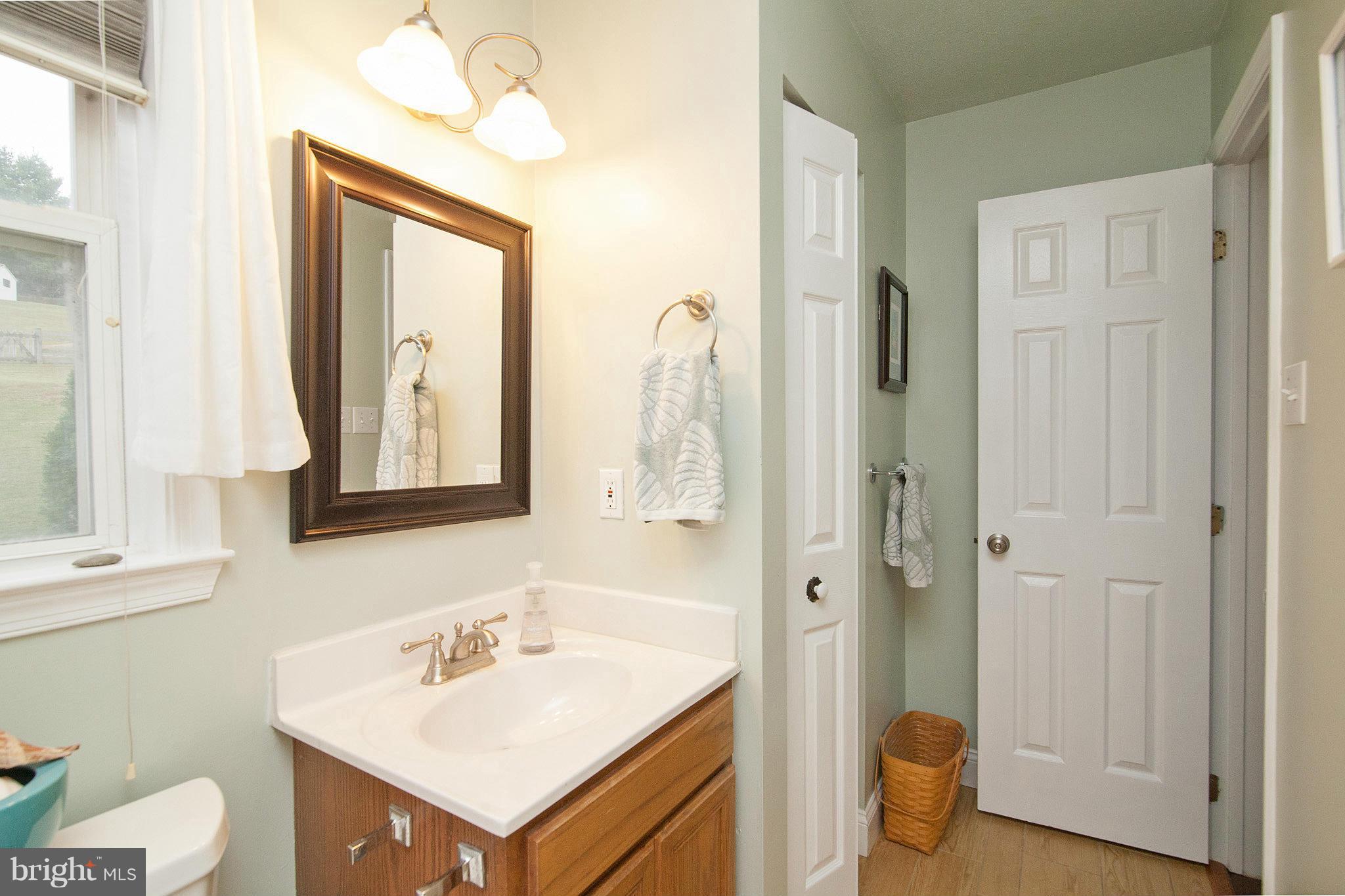 3213 Atlee Ridge Road New Windsor, MD 21776 - Photo 22 of 29 a bathroom with a sink toilet and shower