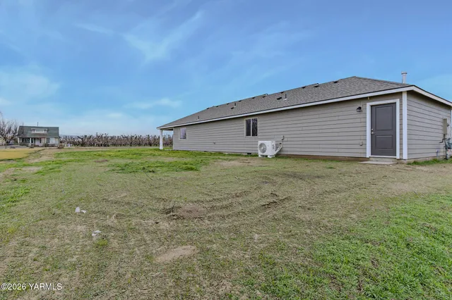 a backyard of a house with lots of green space