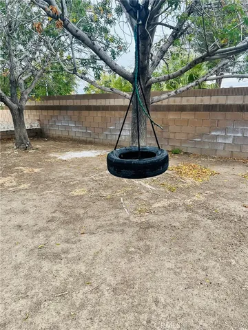 a view of a room with a cabinet and a fireplace