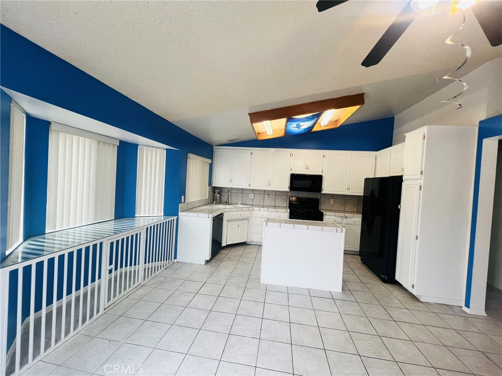 3607 Apollo Avenue Palmdale, CA 93550 - Photo 7 of 17 a living room with furniture and a flat screen tv