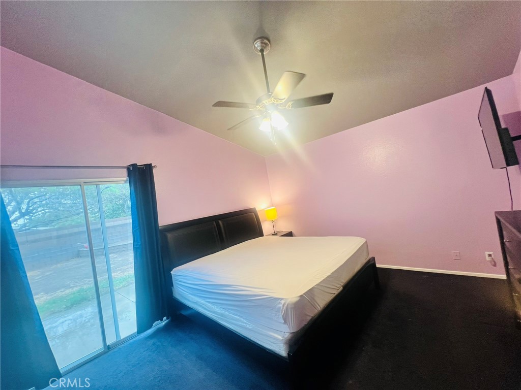 3607 Apollo Avenue Palmdale, CA 93550 - Photo 8 of 17 a bedroom with a bed and a table