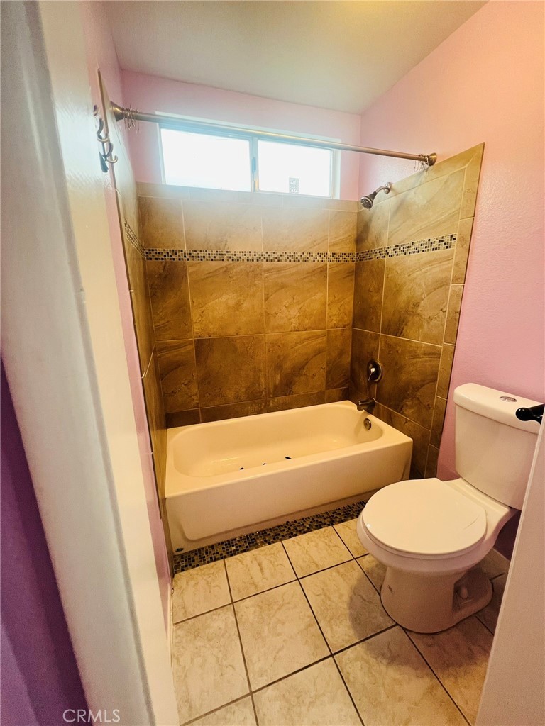 3607 Apollo Avenue Palmdale, CA 93550 - Photo 10 of 17 a bathroom with a tub a toilet and a shower