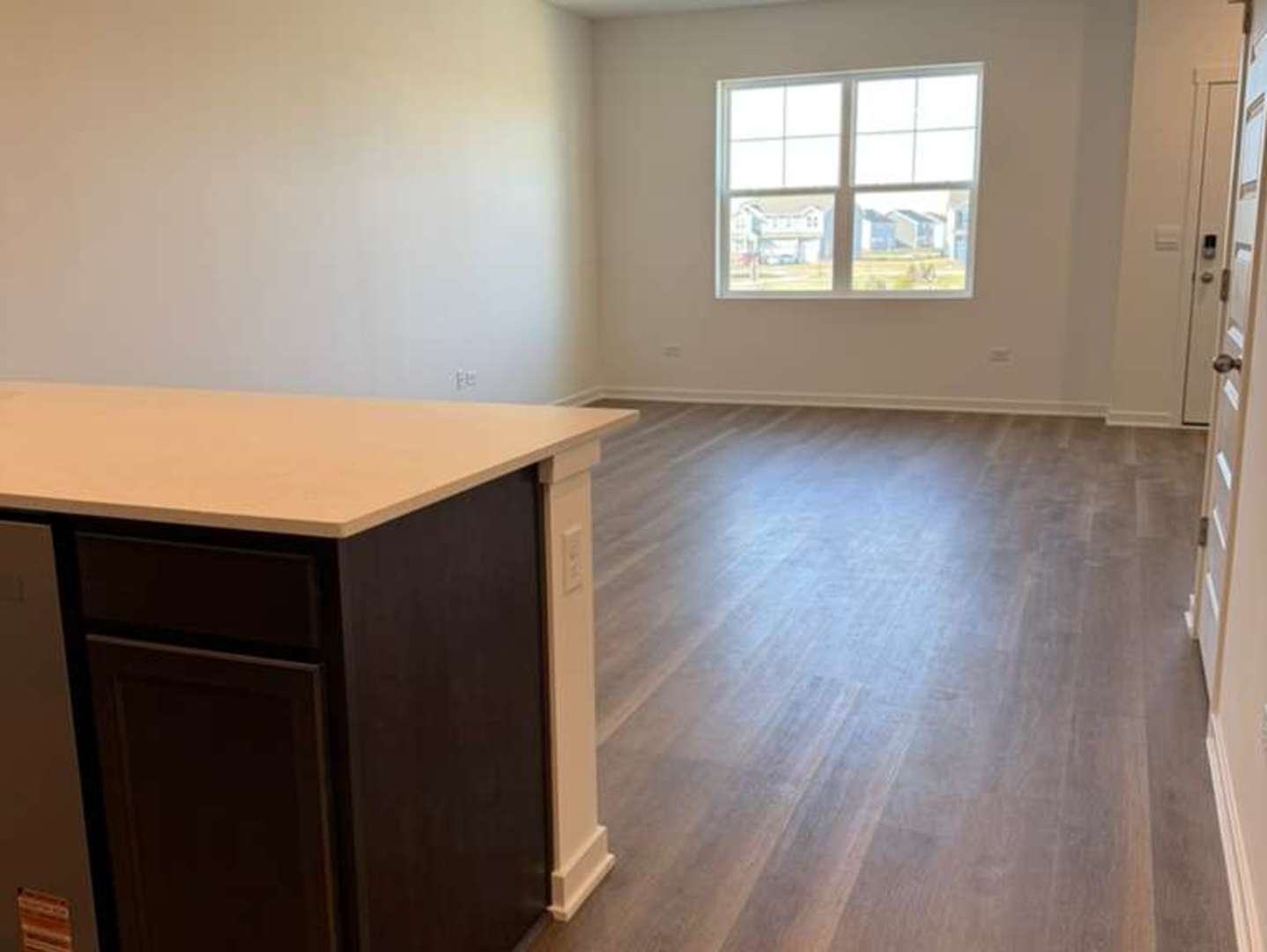 2251 Riesling Road Oswego, IL 60543 - Photo 5 of 13 an empty room with wooden floor and windows