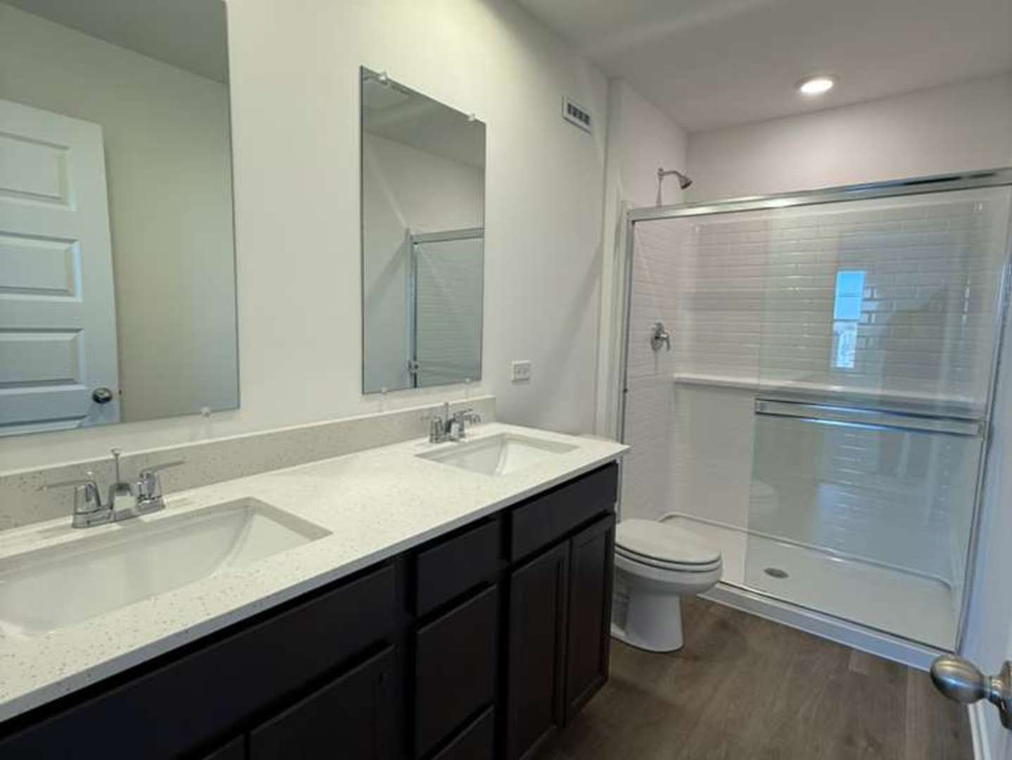 2251 Riesling Road Oswego, IL 60543 - Photo 10 of 13 a bathroom with a double vanity sink toilet and mirror