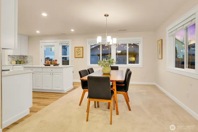 a dining room with furniture and window