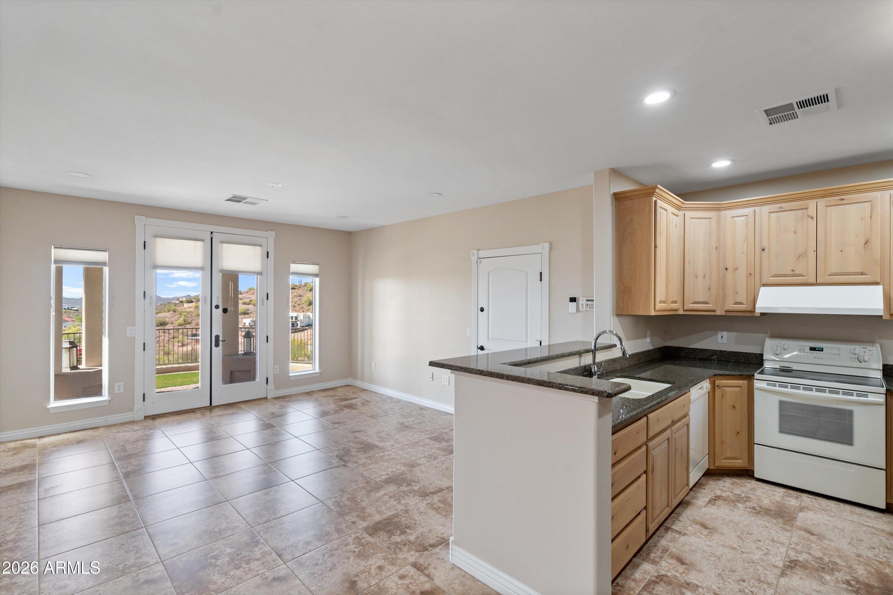 619 East Briles Road Phoenix, AZ 85085 - Photo 62 of 107 062-Lower Unit Kitchen and Family