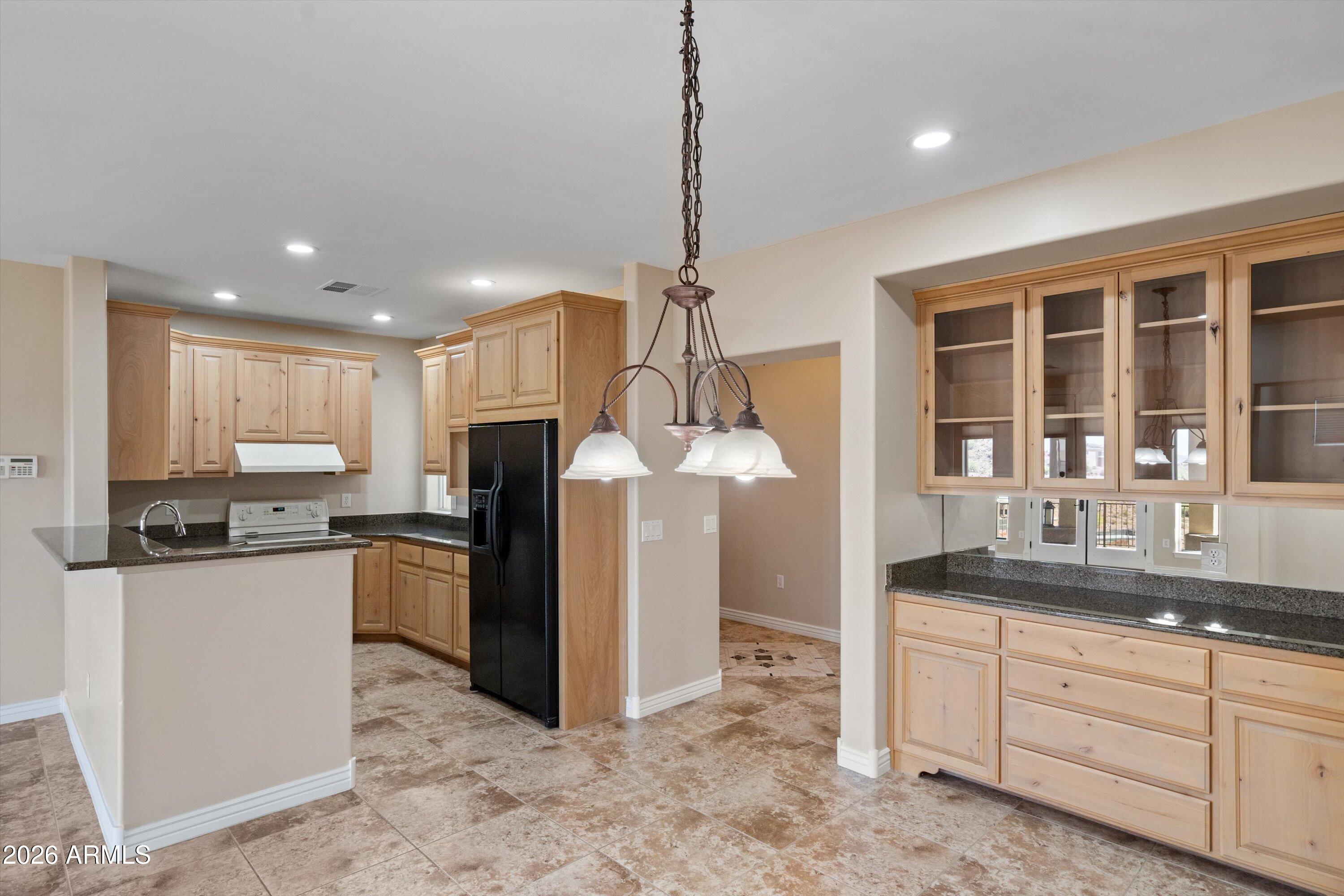 619 East Briles Road Phoenix, AZ 85085 - Photo 66 of 107 066-Lower Unit Dining to Kitchen