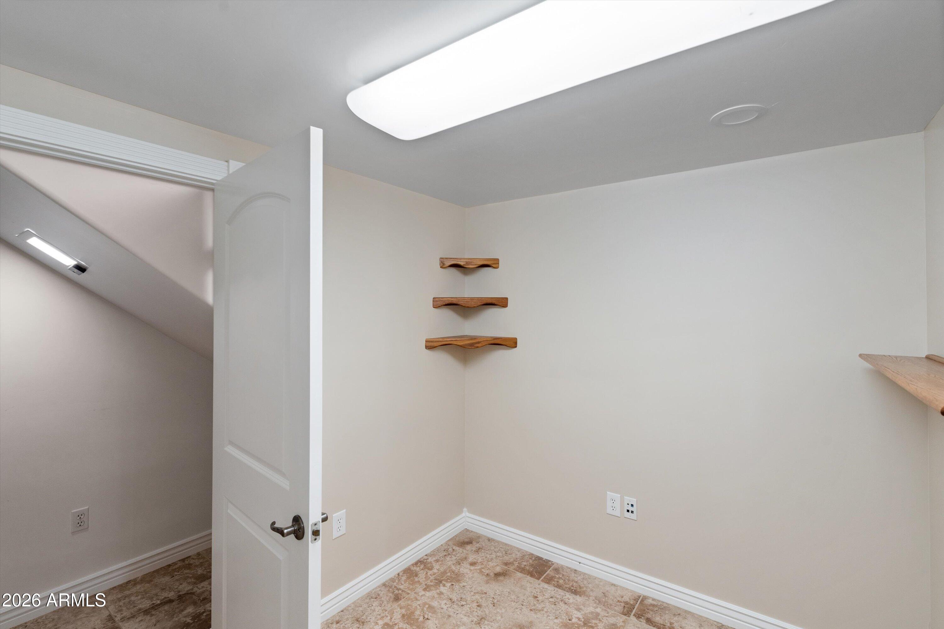 619 East Briles Road Phoenix, AZ 85085 - Photo 70 of 107 070-Lower Unit Laundry and Storage