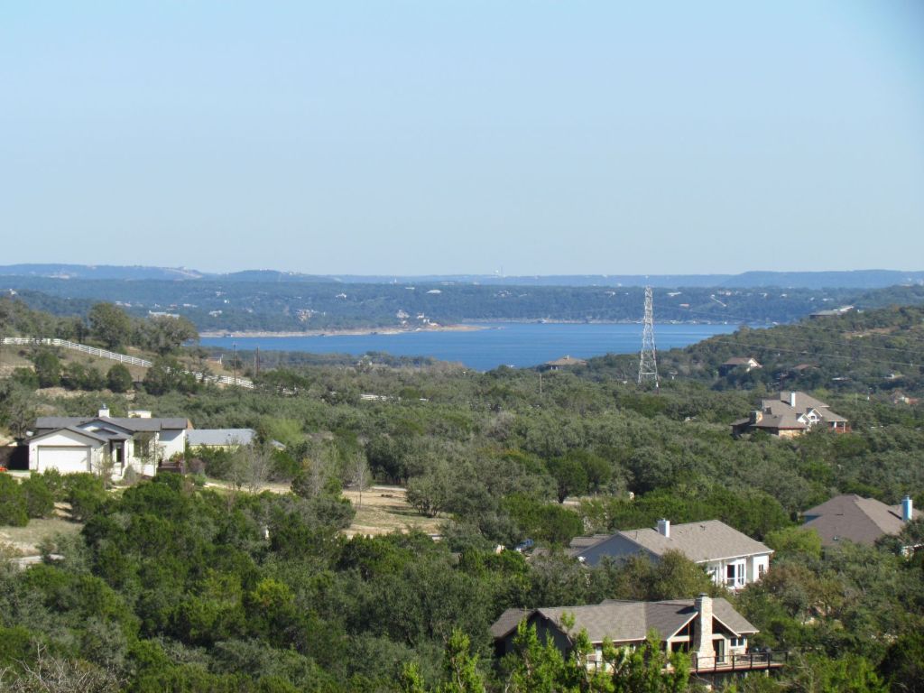 an aerial view of residential house and green space