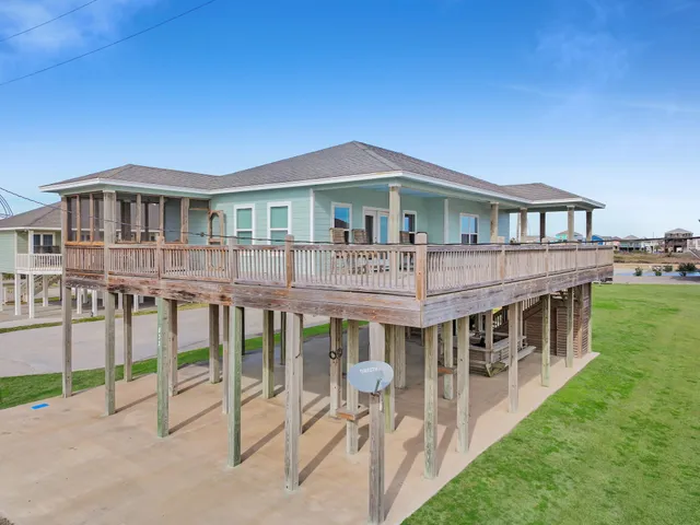 a aerial view of a house with a yard