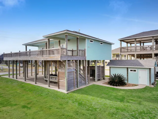 a view of a house with a yard porch and sitting area