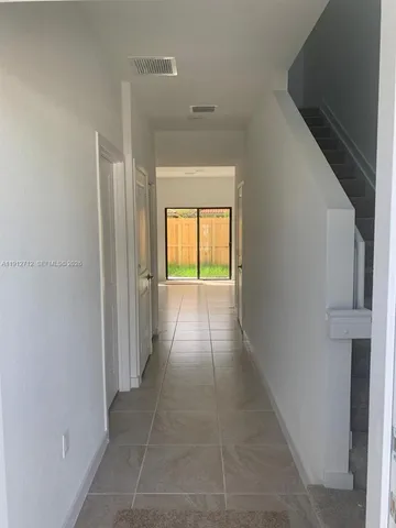 a view of empty room with a window