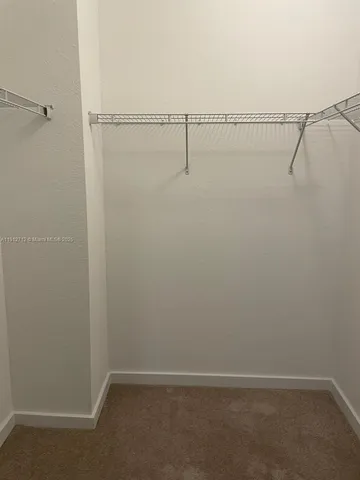 a bathroom with a granite countertop toilet a sink and bathtub