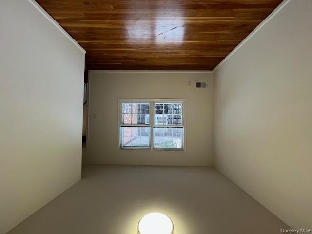 10 Inwood Road, Unit B Port Washington, NY 11050 - Photo 12 of 18 a view of empty room with wooden floor and fan