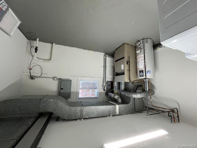 10 Inwood Road, Unit B Port Washington, NY 11050 - Photo 17 of 18 a utility room with cabinets
